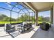 Screened in patio with outdoor seating area, great natural light, and backyard at 6211 Sea Air Dr, Apollo Beach, FL 33572