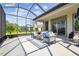 Wide view of screened-in patio with comfortable seating and bright sunlight at 6211 Sea Air Dr, Apollo Beach, FL 33572