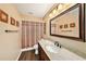 Bathroom features granite countertops and wood-look tile flooring at 6709 Peachtree Dr, Temple Terrace, FL 33617