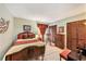 Cozy bedroom features neutral walls, wood furnishings, and large closets at 6709 Peachtree Dr, Temple Terrace, FL 33617
