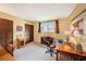 Bedroom features neutral walls, wood furnishings, and large window at 6709 Peachtree Dr, Temple Terrace, FL 33617