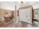 Inviting foyer with wood flooring, a decorative chandelier and an adjacent dining room at 6709 Peachtree Dr, Temple Terrace, FL 33617