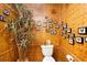 Cozy bathroom with bamboo walls, a unique butterfly decor, and functional layout at 6924 Valrie Ln, Riverview, FL 33569