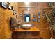 Bathroom with a unique vanity, vessel sink, butterfly decor, and striking design elements at 6924 Valrie Ln, Riverview, FL 33569