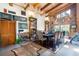 Open dining area with high beamed ceilings, large windows, unique decor, and natural light at 6924 Valrie Ln, Riverview, FL 33569