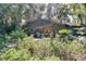 A single-story home is nestled in a lush, green landscape, offering privacy and a connection with nature at 6924 Valrie Ln, Riverview, FL 33569