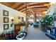 Large living area with vaulted wood ceilings, eclectic decor, and an abundance of natural light at 6924 Valrie Ln, Riverview, FL 33569
