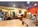 A spacious office features wood floors, colorful walls, and ample natural light, offering a unique workspace at 6924 Valrie Ln, Riverview, FL 33569