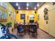 A well-lit office features a desk, seating, and natural light, creating an inviting and productive environment at 6924 Valrie Ln, Riverview, FL 33569