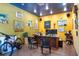A bright office features a full desk setup and natural light, providing an optimal work-from-home environment at 6924 Valrie Ln, Riverview, FL 33569