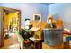 A colorful room with an adjacent doorway is filled with personal items, offering a glimpse into home life at 6924 Valrie Ln, Riverview, FL 33569
