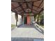 Covered back patio with an open door and a utility sink at 7001 60Th N St, Pinellas Park, FL 33781