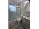 Updated bathroom featuring a shower over tub and modern vanity at 7001 60Th N St, Pinellas Park, FL 33781