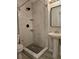 Bathroom with tiled shower and floor, pedestal sink, toilet and mirror at 7001 60Th N St, Pinellas Park, FL 33781