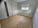 Bright bedroom with wood flooring, window and closet at 7001 60Th N St, Pinellas Park, FL 33781