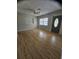 Spacious living room featuring wood floors and a decorative front door at 7001 60Th N St, Pinellas Park, FL 33781