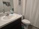 A bathroom with a sink, toilet, and shower at 7575 Sail Clover Ln, Zephyrhills, FL 33540