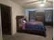 This spacious bedroom features a ceiling fan, and carpet floors at 7575 Sail Clover Ln, Zephyrhills, FL 33540