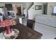 Open concept living space showcasing a modern kitchen, dining area, and comfortable living room at 7575 Sail Clover Ln, Zephyrhills, FL 33540