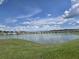 Picturesque lake view highlighting the serene environment and lush green surroundings at 7575 Sail Clover Ln, Zephyrhills, FL 33540