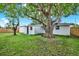 Large backyard with mature trees and a rope swing at 7835 Wallaba Ln, New Port Richey, FL 34653