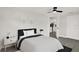 Modern bedroom with a cozy bed, nightstands, and a closet at 7835 Wallaba Ln, New Port Richey, FL 34653