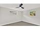 Bedroom features two windows and a modern ceiling fan at 7835 Wallaba Ln, New Port Richey, FL 34653