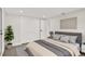 Neutral bedroom with gray accents, a double closet, and a cozy atmosphere at 7835 Wallaba Ln, New Port Richey, FL 34653