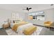 The bright bedroom boasts a large window, neutral decor, and comfortable seating at 7835 Wallaba Ln, New Port Richey, FL 34653