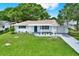 Beautiful single-story home with green lawn at 7835 Wallaba Ln, New Port Richey, FL 34653
