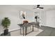 Modern home office featuring a desk, a neutral color scheme, and plenty of natural light at 7835 Wallaba Ln, New Port Richey, FL 34653