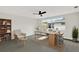 This light and airy home office features modern decor and a large window at 7835 Wallaba Ln, New Port Richey, FL 34653