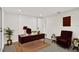 Bright home office with modern desk, decor, and stylish accent chair at 7835 Wallaba Ln, New Port Richey, FL 34653