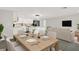 Open-concept living space with dining room, kitchen and living room with cream colored sofa at 7835 Wallaba Ln, New Port Richey, FL 34653