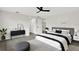 The main bedroom features neutral decor, a ceiling fan, and ample closet space at 7835 Wallaba Ln, New Port Richey, FL 34653