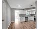 Modern kitchen featuring white cabinetry, stainless steel appliances, and sleek countertops at 8033 Norwich Dr, Port Richey, FL 34668