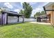 Spacious backyard showcasing a modern pergola, inviting pool, and screened patio, ideal for outdoor entertainment at 8927 95Th N St, Seminole, FL 33777