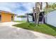 Landscaped backyard featuring a stylish pergola and green lawn perfect for outdoor gatherings and relaxation at 8927 95Th N St, Seminole, FL 33777