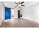 Bedroom showcasing an barn-style sliding door leading to the bathroom and hardwood floors at 8927 95Th N St, Seminole, FL 33777