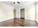 Bedroom with wood-look tile, closet and ample natural light at 8927 95Th N St, Seminole, FL 33777
