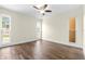 Bedroom featuring wood-look tile flooring, ceiling fan, and natural light at 8927 95Th N St, Seminole, FL 33777