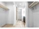 Hallway with a view of the closet and bathroom at 8927 95Th N St, Seminole, FL 33777