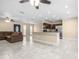 Bright living space with tile flooring, breakfast bar, and open access to the kitchen and outdoor patio area at 8927 95Th N St, Seminole, FL 33777