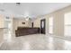 Spacious living room with tile flooring, ceiling fan, and ample natural light, perfect for relaxing and entertaining at 8927 95Th N St, Seminole, FL 33777