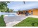 Backyard pool with a screened in lanai and white privacy fence, perfect for outdoor living and entertainment at 8927 95Th N St, Seminole, FL 33777