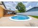Inviting pool with a white fence, screened lanai and lush greenery, perfect for outdoor relaxation and entertaining at 8927 95Th N St, Seminole, FL 33777
