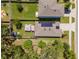 Home aerial view featuring a backyard gazebo, lush lawn, solar panels, and a well-maintained fence for privacy at 9016 Water Chestnut Dr, Temple Terrace, FL 33637