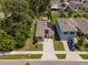 Aerial view of a cozy home with solar panels, a backyard gazebo, and lush landscaping in a friendly neighborhood at 9016 Water Chestnut Dr, Temple Terrace, FL 33637
