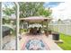 Inviting backyard with patio, gazebo with table and chairs, plus a well-maintained lawn perfect for relaxation and entertaining at 9016 Water Chestnut Dr, Temple Terrace, FL 33637