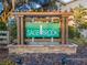 Welcoming Sagebrook community sign with stone accents, nestled in lush landscaping, creating a warm and inviting atmosphere at 9016 Water Chestnut Dr, Temple Terrace, FL 33637